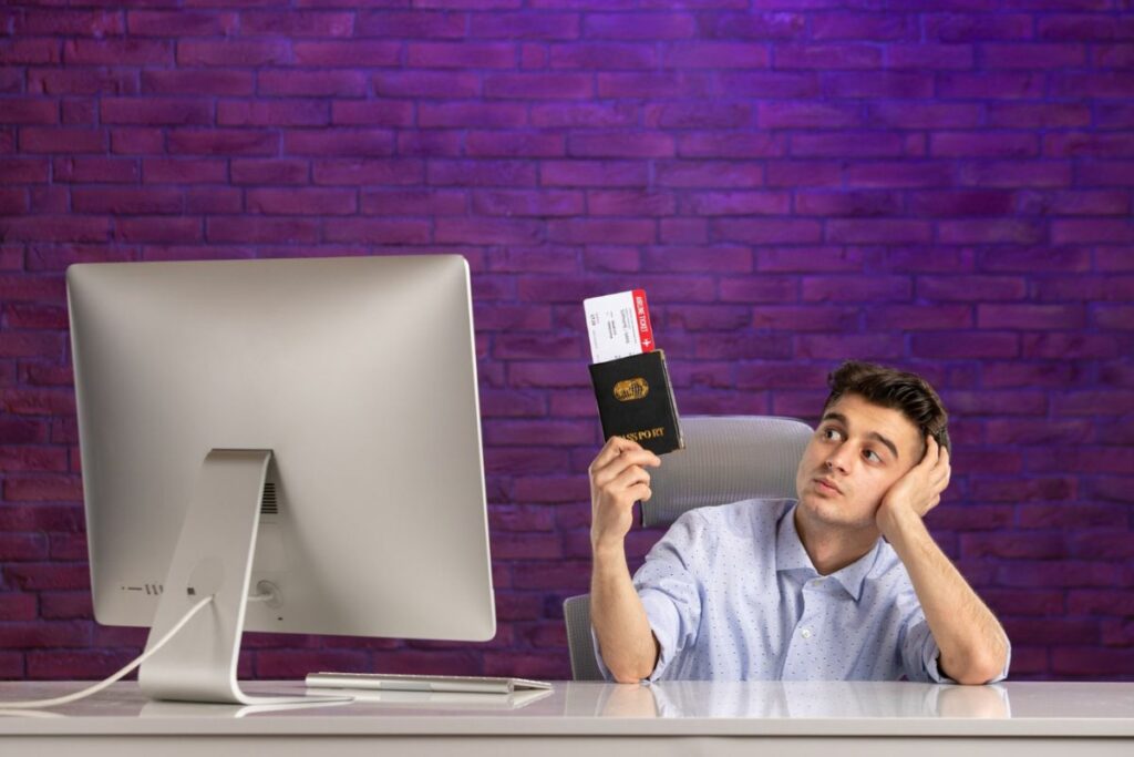 Man Sitting His Working Place With Passport Tickets